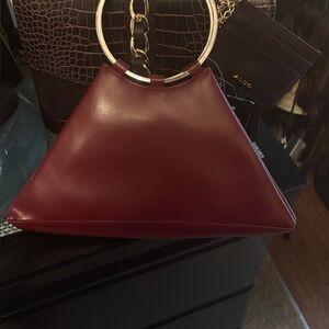 Wilsons Maroon Triangle Clutch with Gold Accents.. classic , sleek vintage look